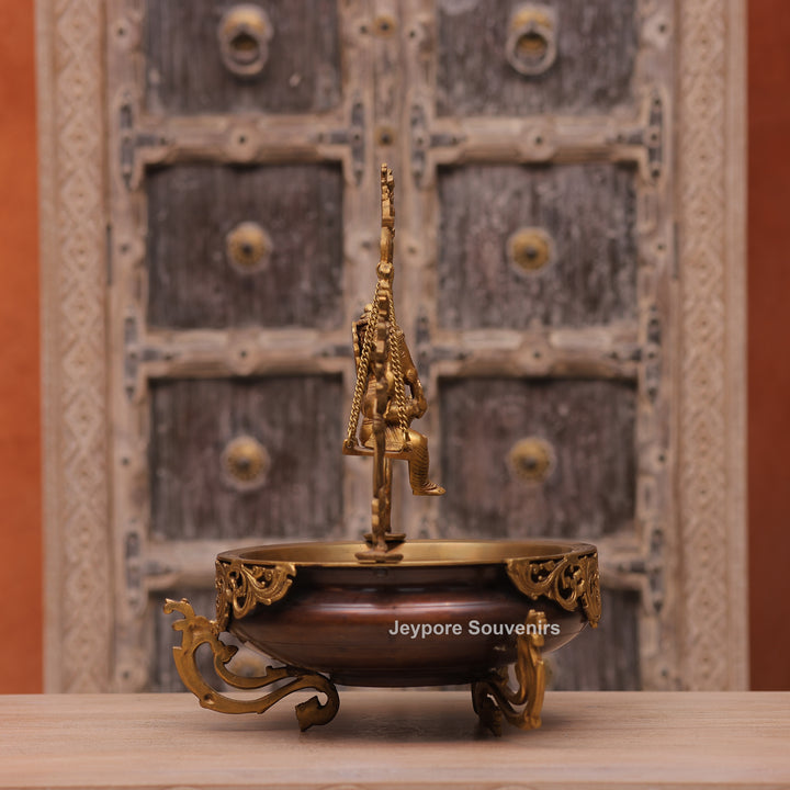 Traditional Handcrafted Brass Ganesha Swing Urli Bowl with Decorative Arch