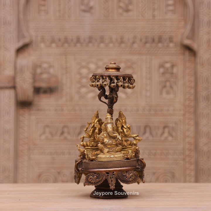 Handcrafted Brass Ganesha Lakshmi Saraswati Revolving Idol with Decorative Parasol