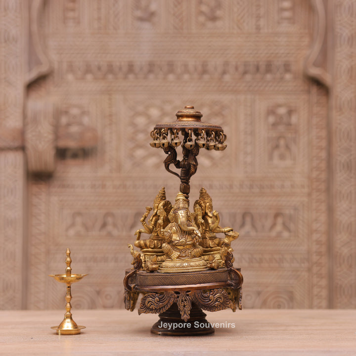 Handcrafted Brass Ganesha Lakshmi Saraswati Revolving Idol with Decorative Parasol