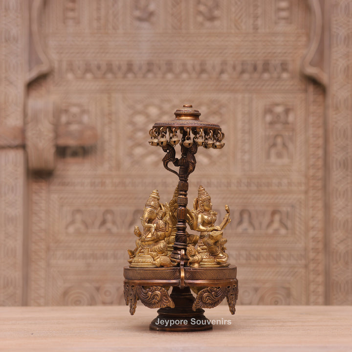 Handcrafted Brass Ganesha Lakshmi Saraswati Revolving Idol with Decorative Parasol