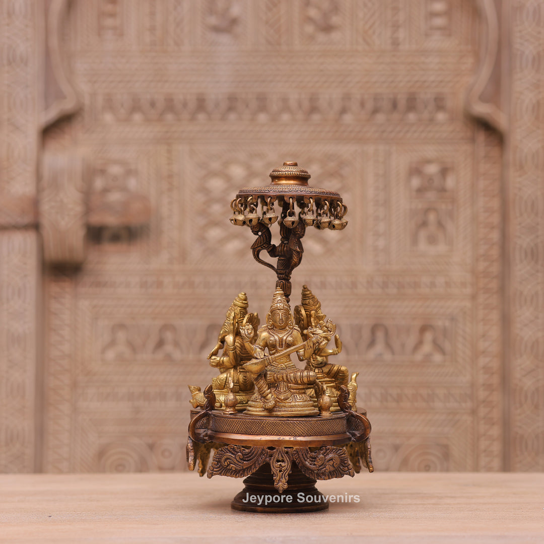 Handcrafted Brass Ganesha Lakshmi Saraswati Revolving Idol with Decorative Parasol
