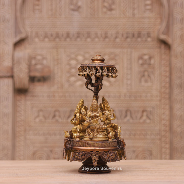 Handcrafted Brass Ganesha Lakshmi Saraswati Revolving Idol with Decorative Parasol