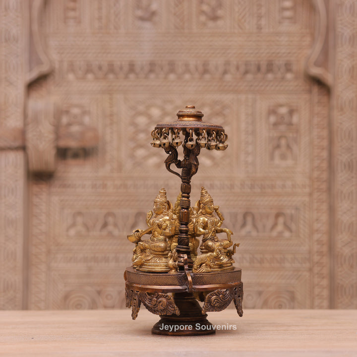 Handcrafted Brass Ganesha Lakshmi Saraswati Revolving Idol with Decorative Parasol
