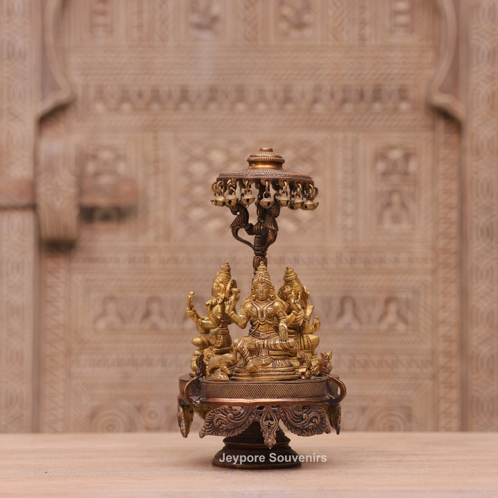 Handcrafted Brass Ganesha Lakshmi Saraswati Revolving Idol with Decorative Parasol