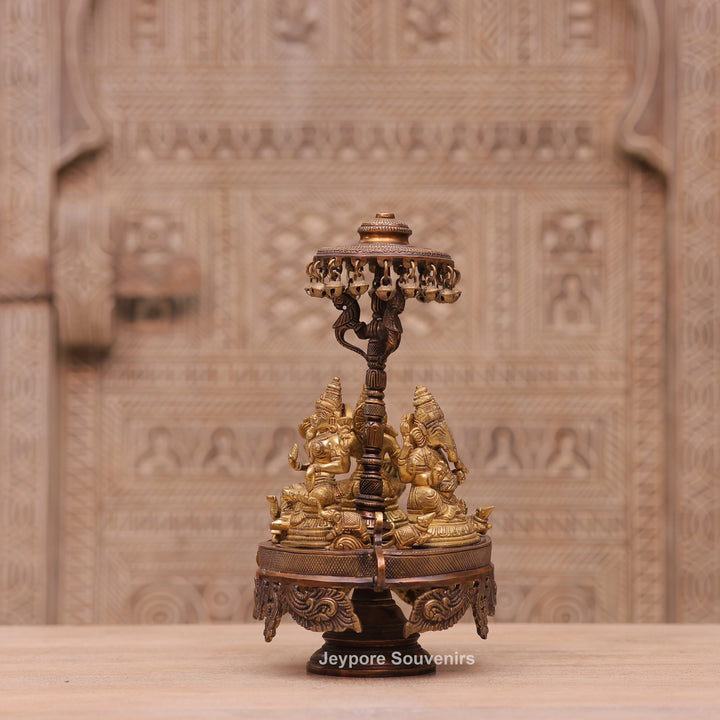 Handcrafted Brass Ganesha Lakshmi Saraswati Revolving Idol with Decorative Parasol