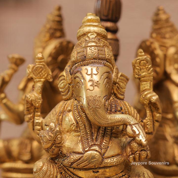 Handcrafted Brass Ganesha Lakshmi Saraswati Revolving Idol with Decorative Parasol