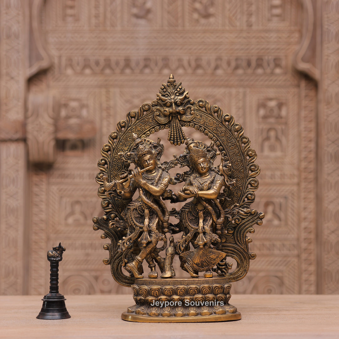 Handcrafted Brass Radha Krishna Statue with Ornamental Prabhavali Arch