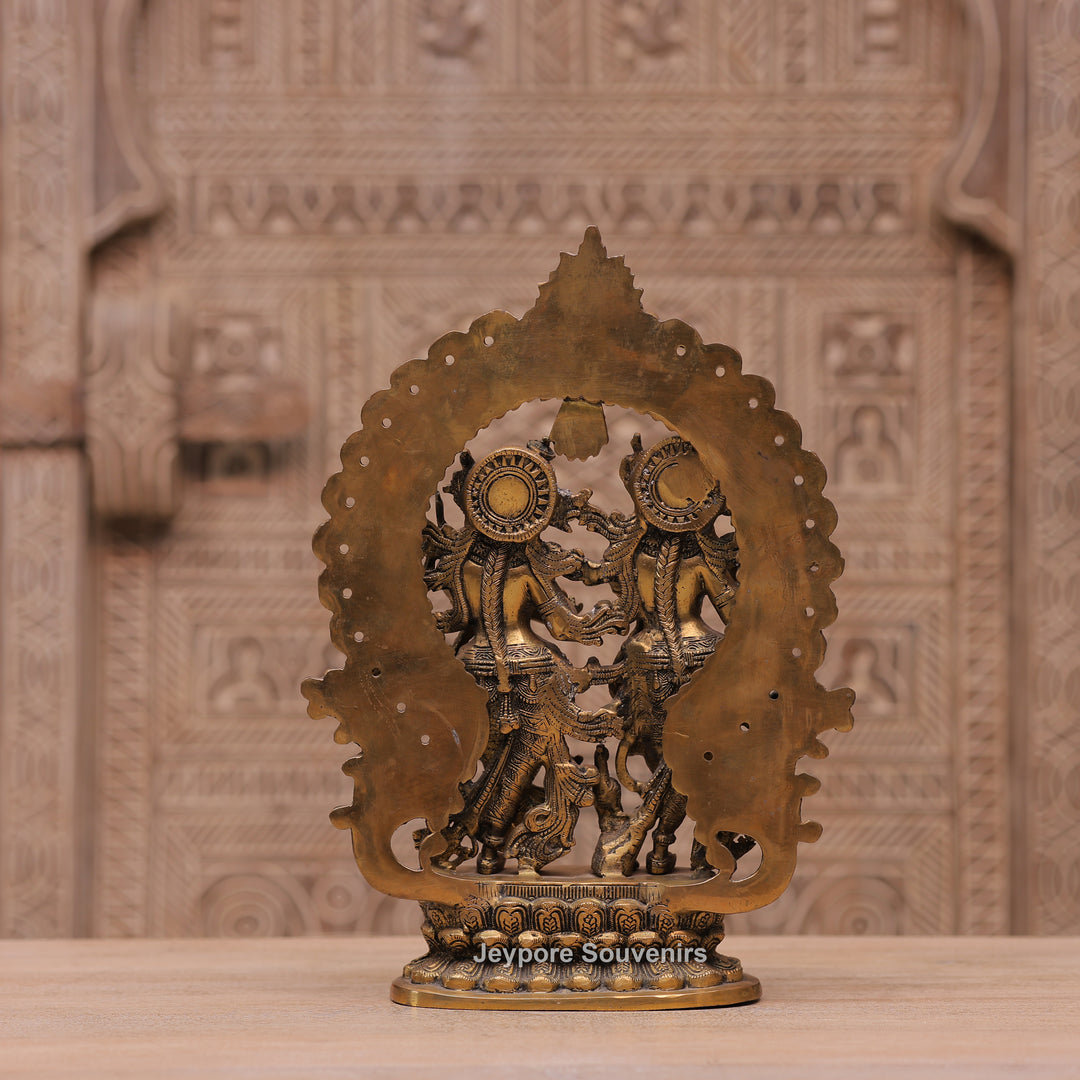 Handcrafted Brass Radha Krishna Statue with Ornamental Prabhavali Arch
