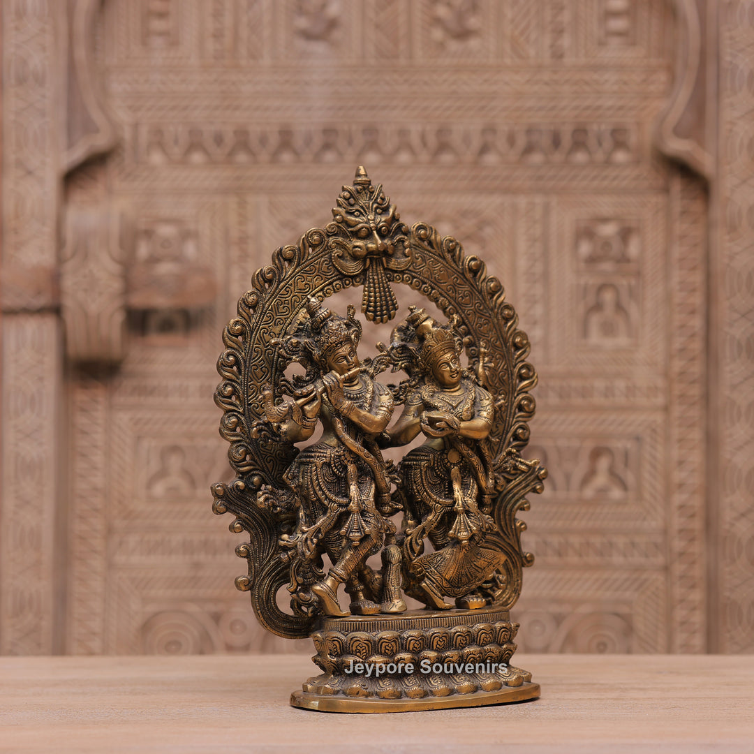 Handcrafted Brass Radha Krishna Statue with Ornamental Prabhavali Arch