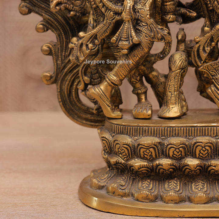 Handcrafted Brass Radha Krishna Statue with Ornamental Prabhavali Arch
