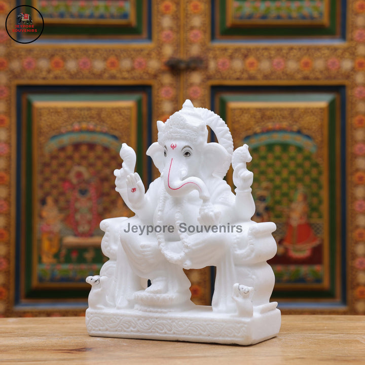 Handcrafted Pure White Marble Lord Ganesha Idol Seated on Ornate Throne