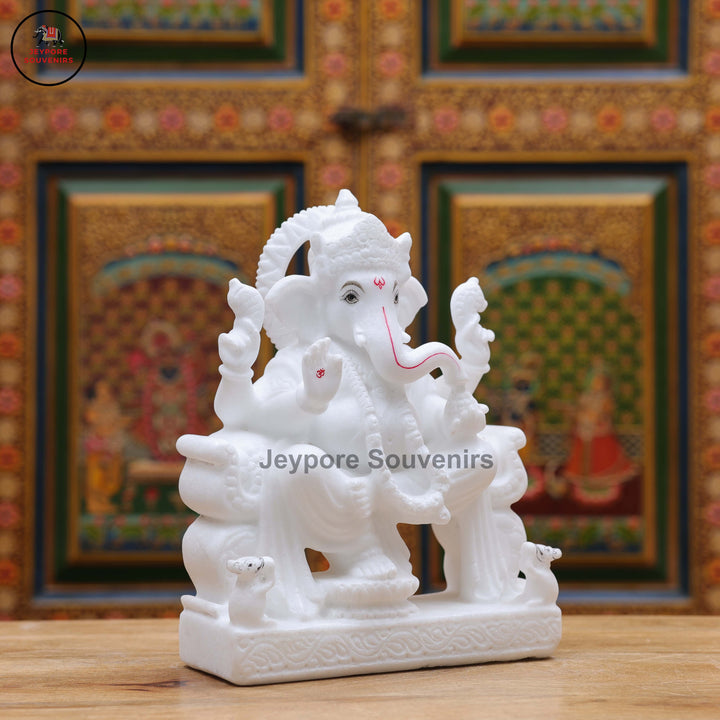 Handcrafted Pure White Marble Lord Ganesha Idol Seated on Ornate Throne