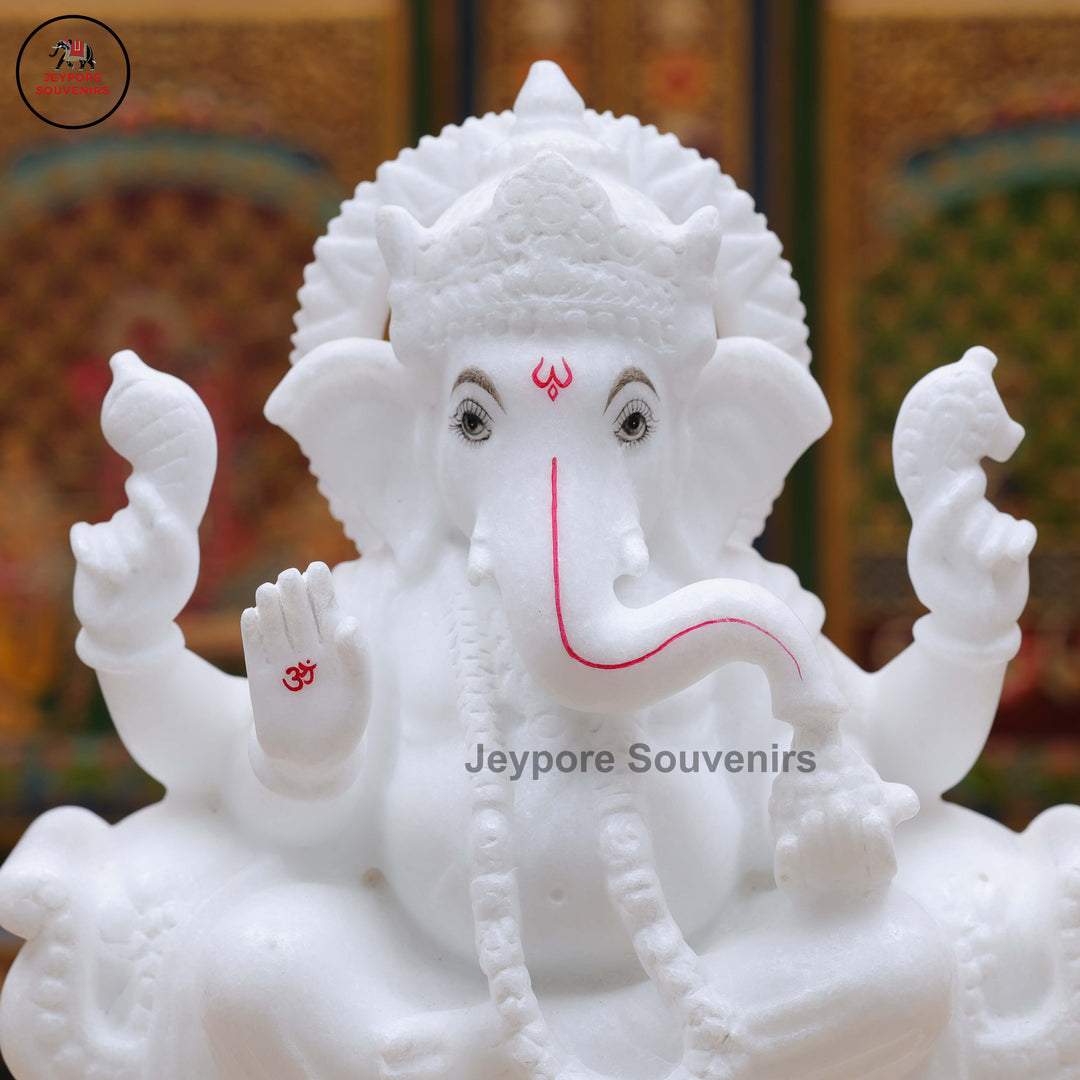 Handcrafted Pure White Marble Lord Ganesha Idol Seated on Ornate Throne