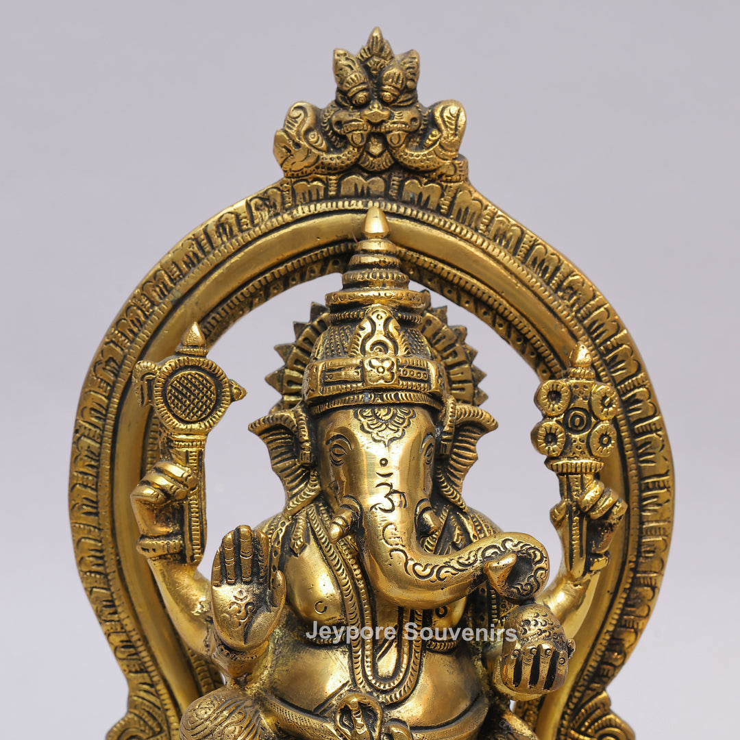 Handcrafted Brass Lord Ganesha Idol with Ornate Prabhavali Arch