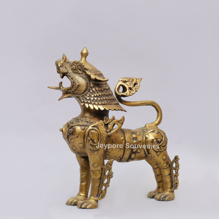 Handcrafted Solid Brass Tibetan Snow Standing Lion Statue with Ornate Scrollwork