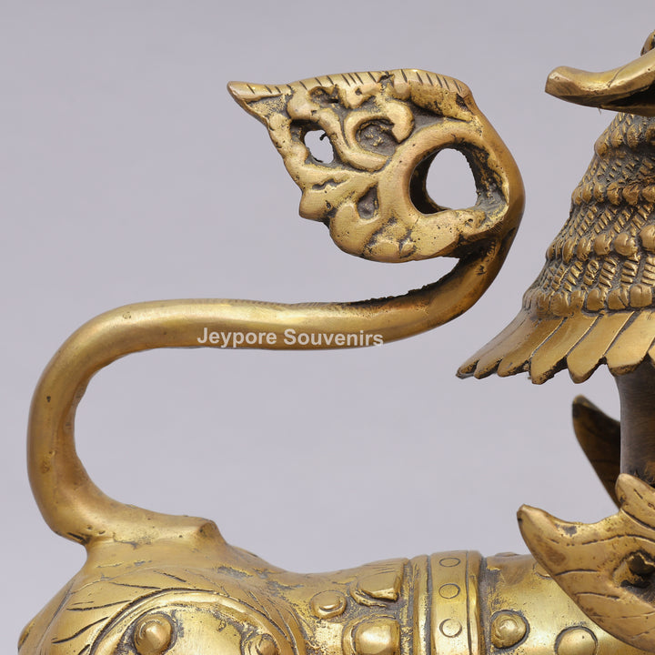 Handcrafted Solid Brass Tibetan Snow Standing Lion Statue with Ornate Scrollwork