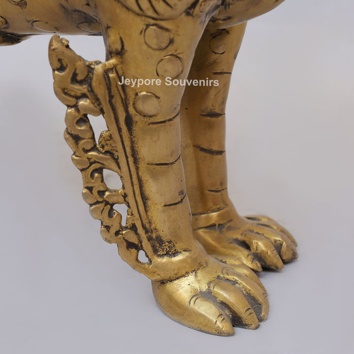 Handcrafted Solid Brass Tibetan Snow Standing Lion Statue with Ornate Scrollwork