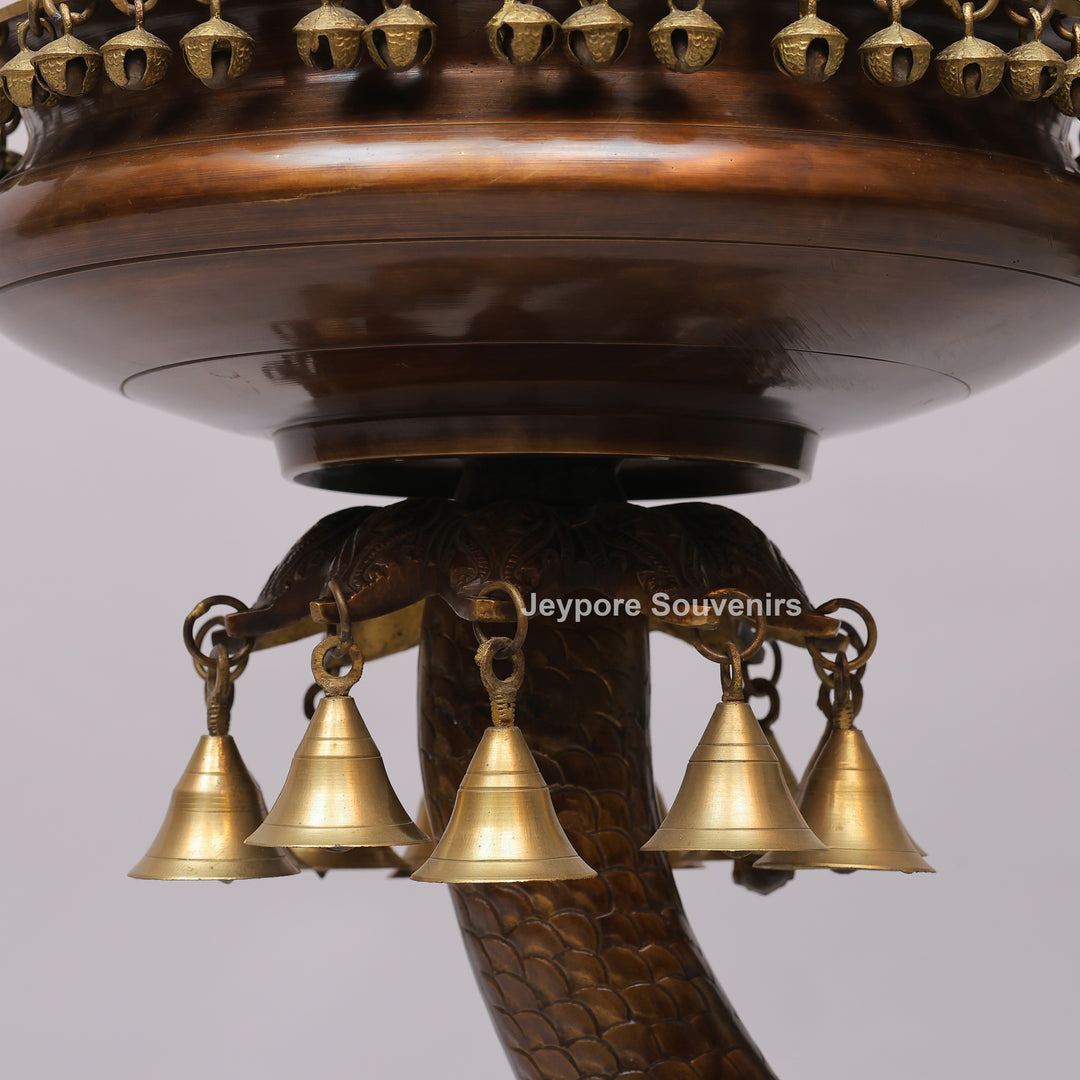 Brass Urli Bowl on Ornate Fish Stand with Hanging Bells