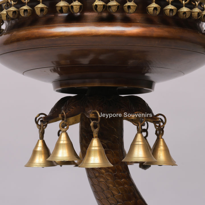 Brass Urli Bowl on Ornate Fish Stand with Hanging Bells