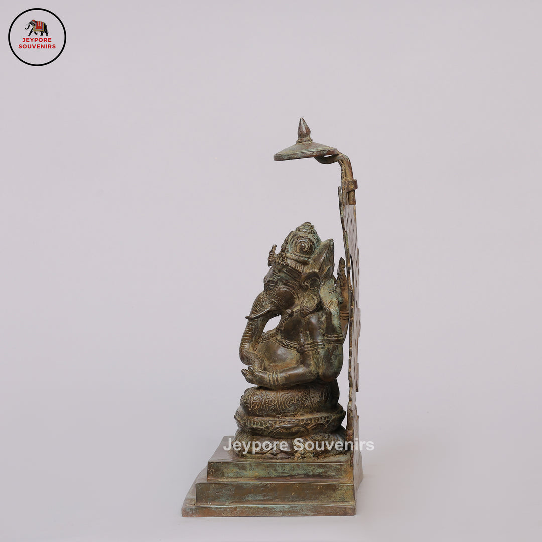 Handcrafted Bronze Ganesha Statue with Ornate Prabhavali