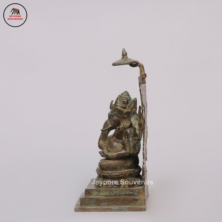 Handcrafted Bronze Ganesha Statue with Ornate Prabhavali