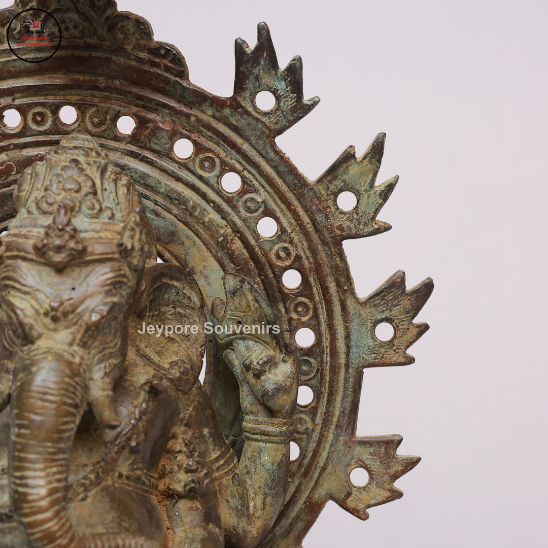 Handcrafted Bronze Ganesha Statue with Ornate Prabhavali