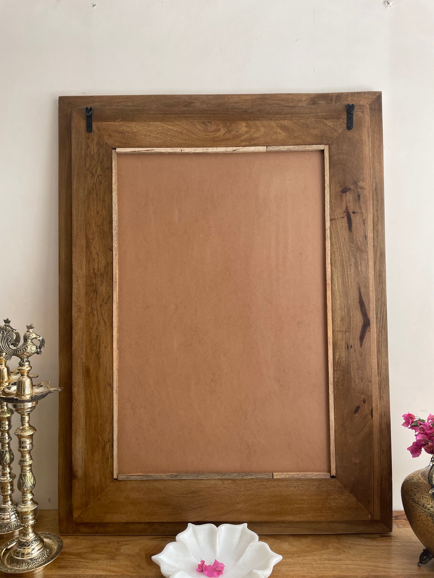 Hand carved mirror frame in distressed finish