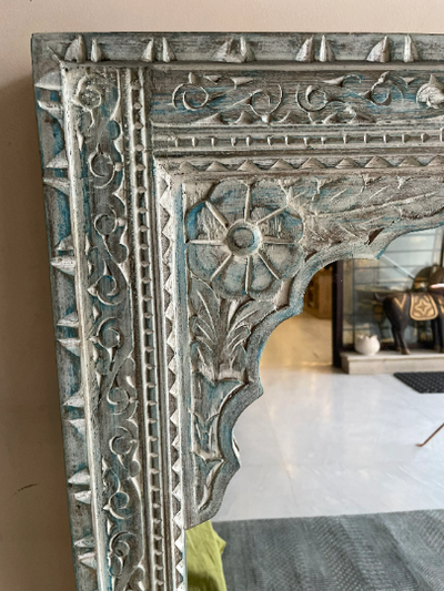 Hand carved mirror in distressed finish