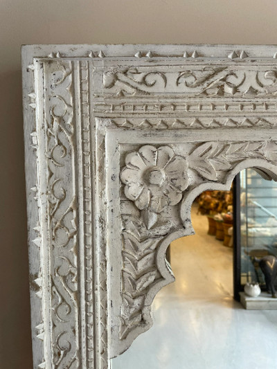 Hand carved mirror in distressed finish