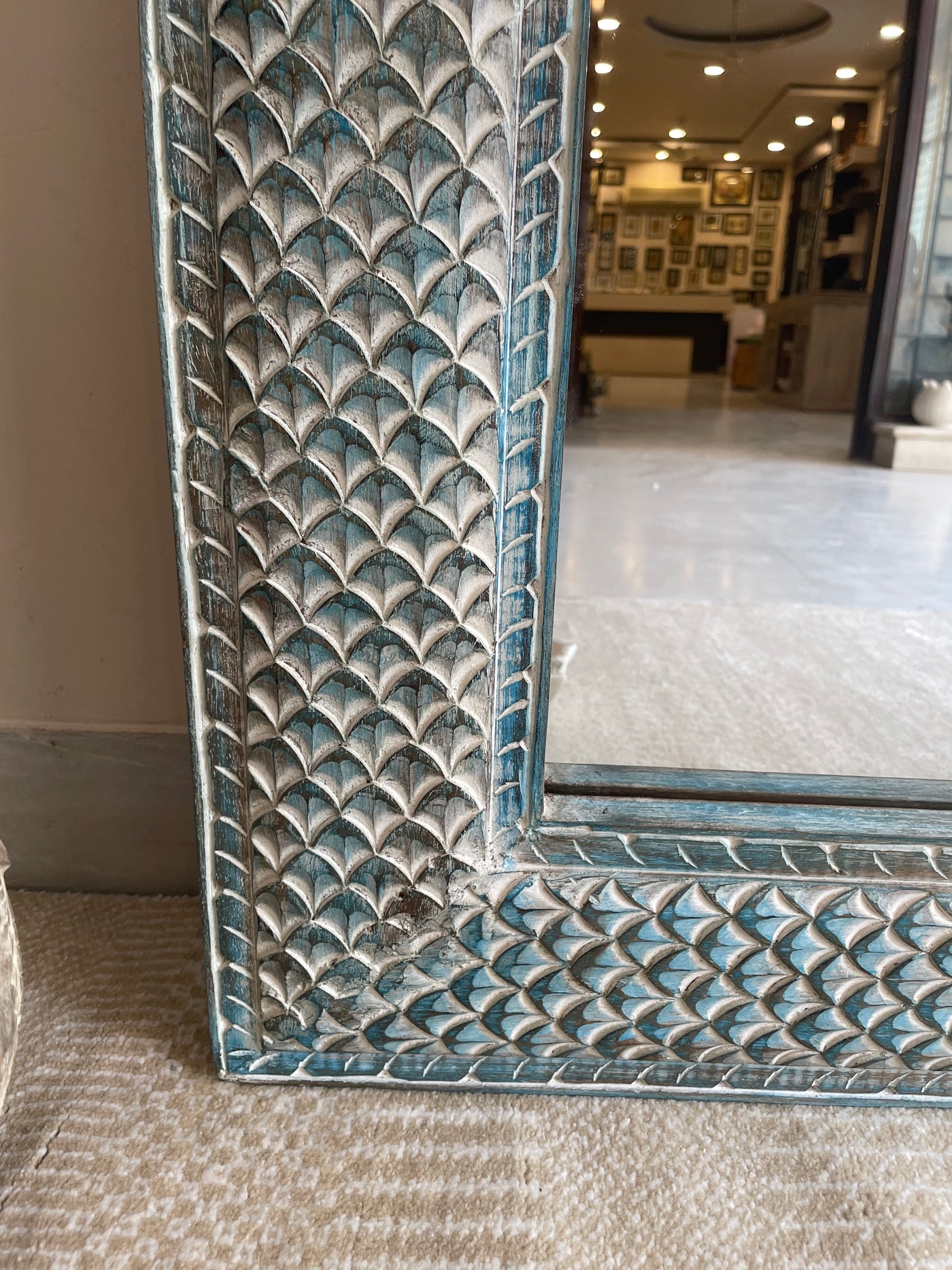 Hand carved mirror in distressed finish