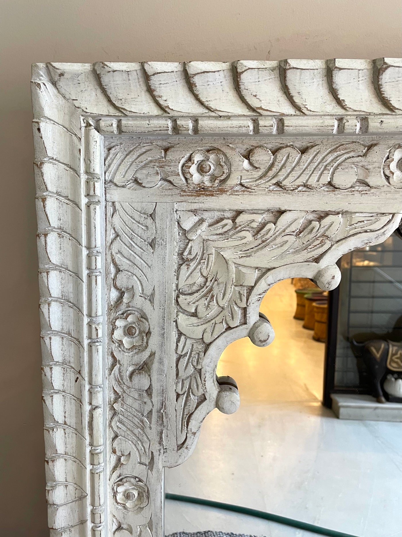 Hand carved mirror in distressed finish