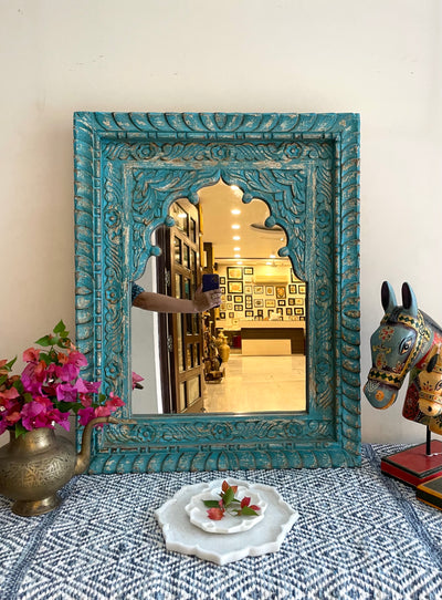 Hand carved mirror in distressed finish