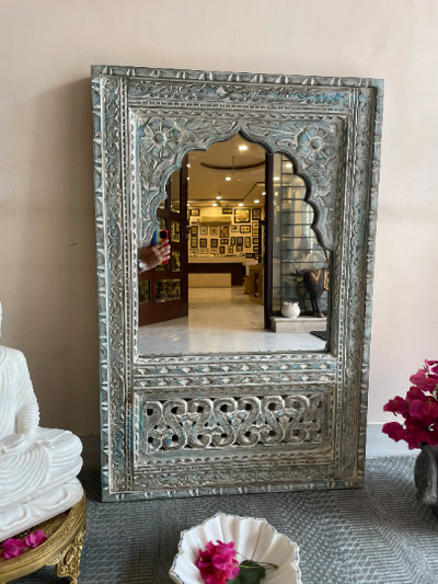 Hand carved mirror in distressed finish